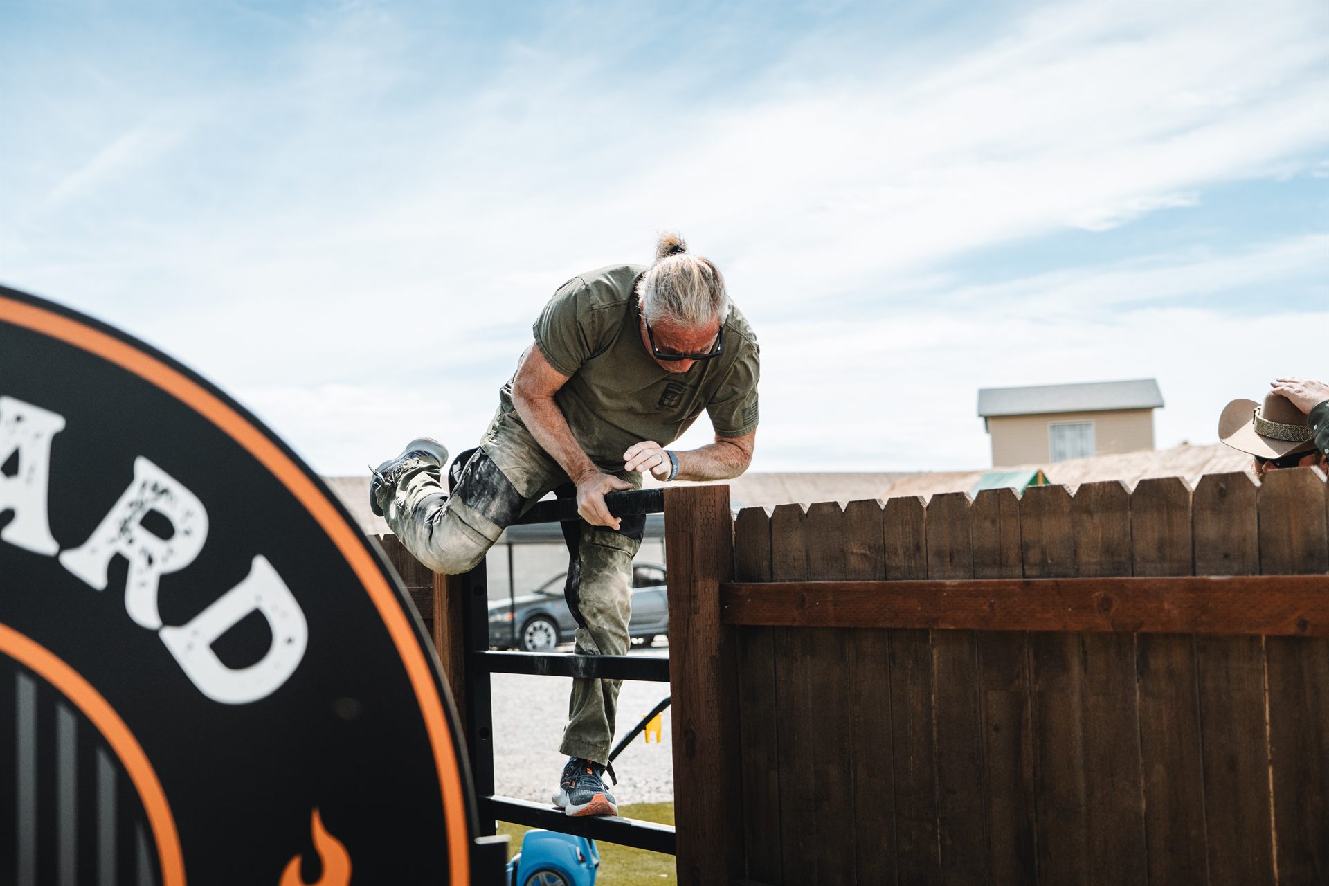 A shooter going over the backyard fence on the Backyard BBQ course at Staccato Ranch Vegas.